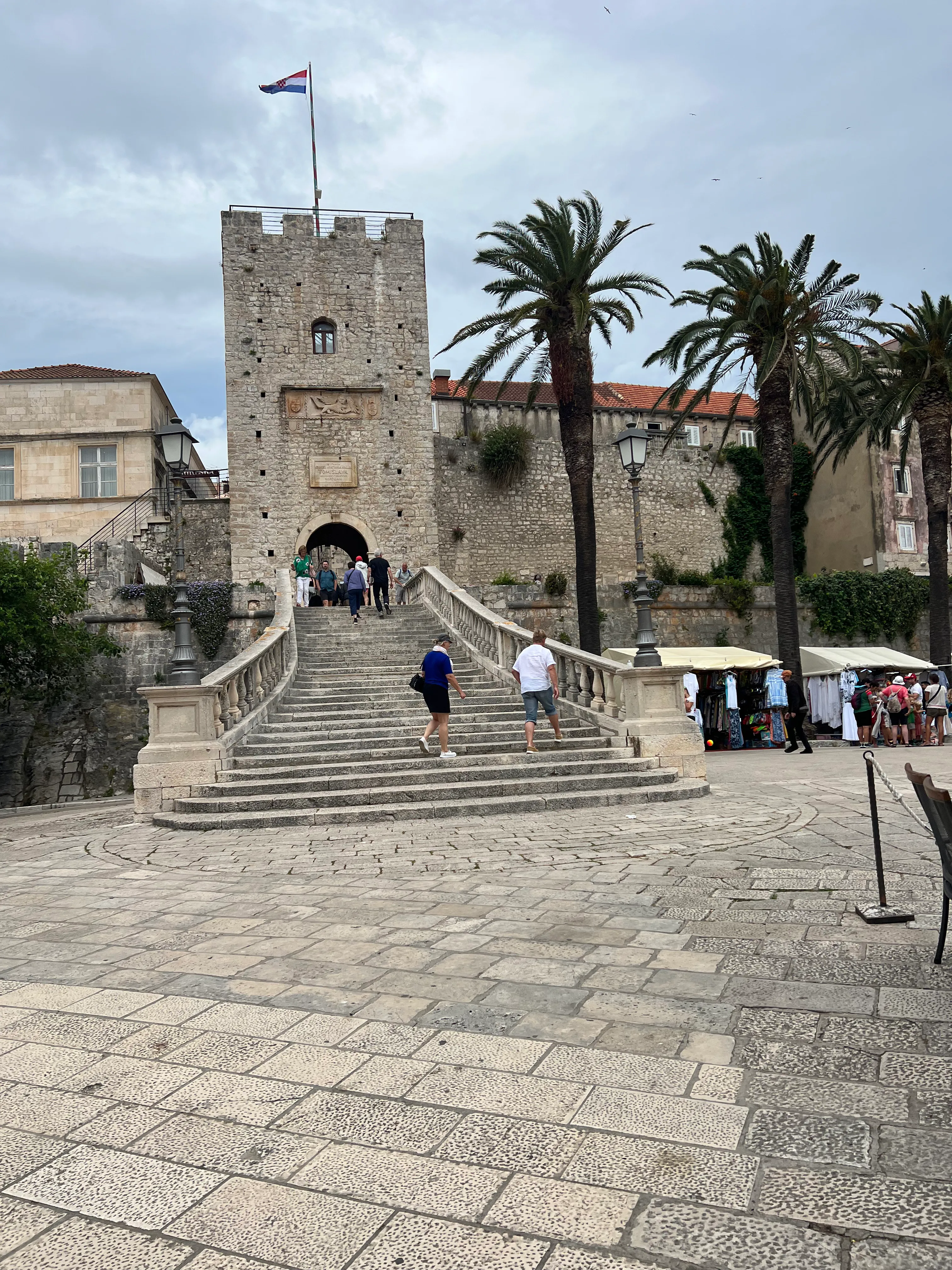 Stone bridge steps leading to KorcÌula old town tower gate, Croatia.jpg